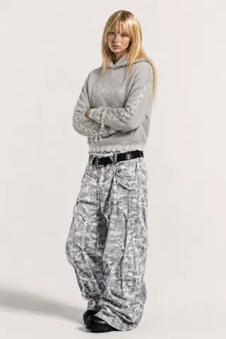 Model wearing the Lunette hoodie in studio light